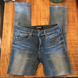 Express lightly distressed med wash skinny jeans